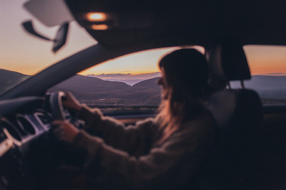 Image of a person taking driving lessons with an instructor