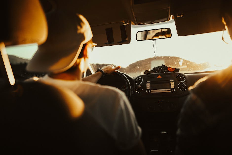 Image of a person signing up for a driving school